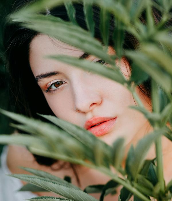 Woman focusing peacefully with her eyes closed in a calm environment.